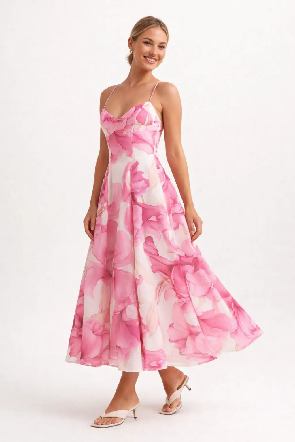 Woman wearing a pink floral dress on a white background