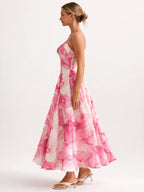 Woman wearing a pink floral dress on a white background
