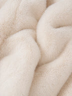 Close-up of soft, beige fabric texture