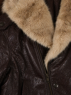 Close-up of a leather jacket with fur collar