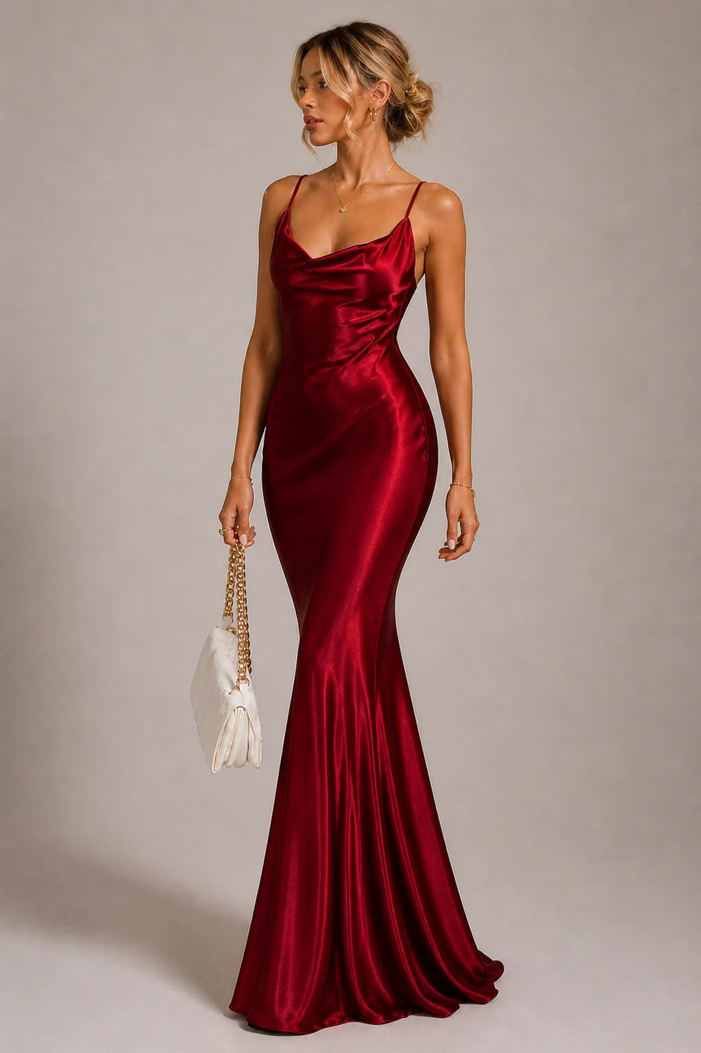 Woman wearing a red satin dress against a neutral background