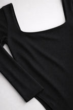 Black long-sleeve top on a white background