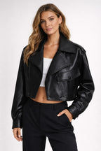 Woman wearing a black leather jacket on a white background